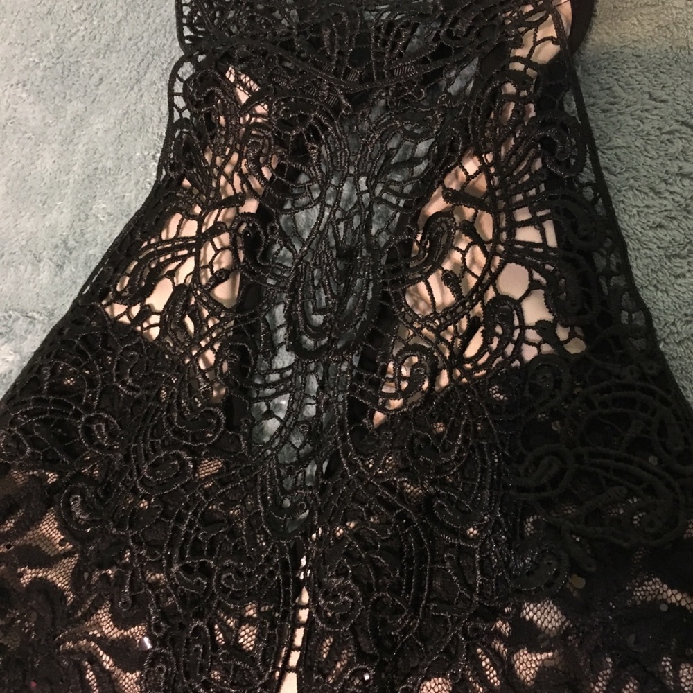 Slim black lace dress.